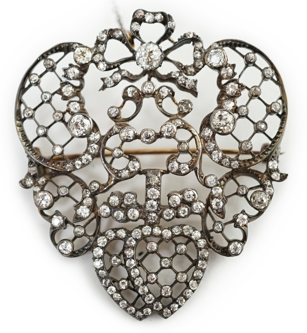 A Victorian gold, silver and diamond cluster set open work brooch